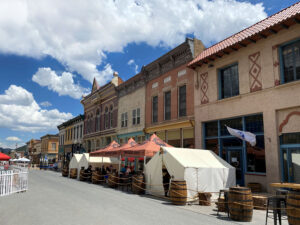 Photo of miner street in Idaho springs with tents in front of the storefronts